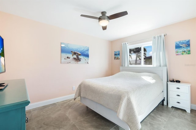 bedroom featuring tile patterned flooring and ceiling fan