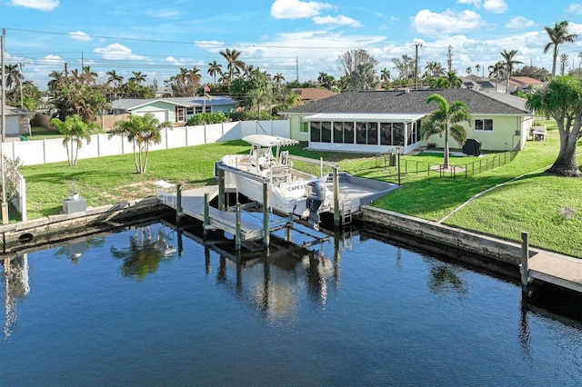 view of dock featuring a water view and a lawn