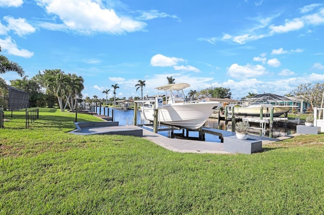 view of dock featuring a yard and a water view