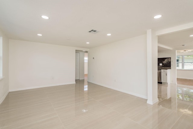 unfurnished room featuring light tile patterned flooring