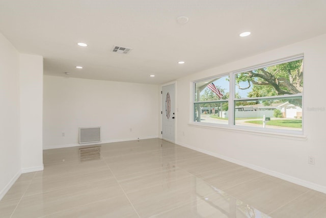 empty room with light tile patterned floors