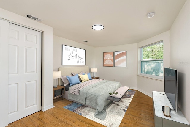 bedroom with hardwood / wood-style flooring