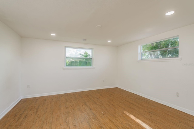 spare room featuring light hardwood / wood-style floors