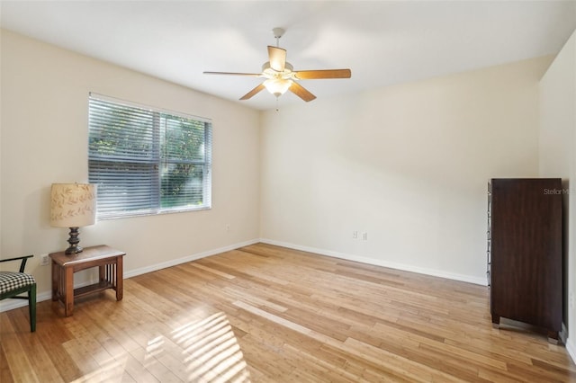 spare room with ceiling fan and light hardwood / wood-style floors