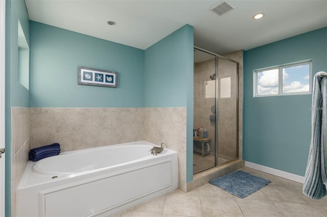 bathroom with tile patterned floors and plus walk in shower