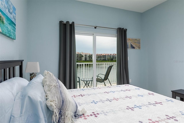 bedroom featuring a water view