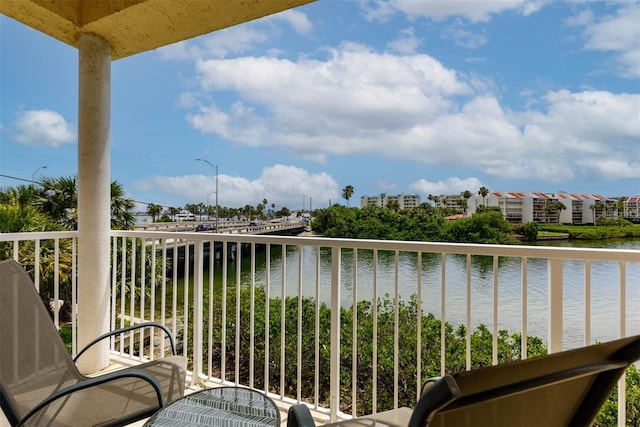 balcony featuring a water view