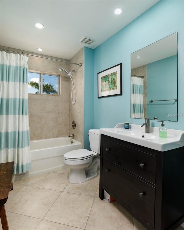 full bathroom featuring vanity, toilet, tile patterned floors, and shower / tub combo