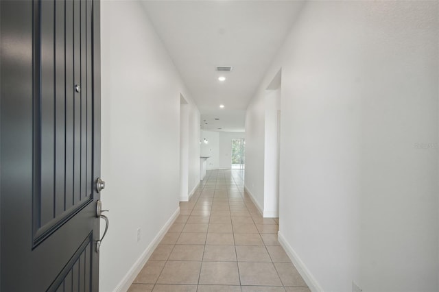 hallway featuring light tile patterned floors