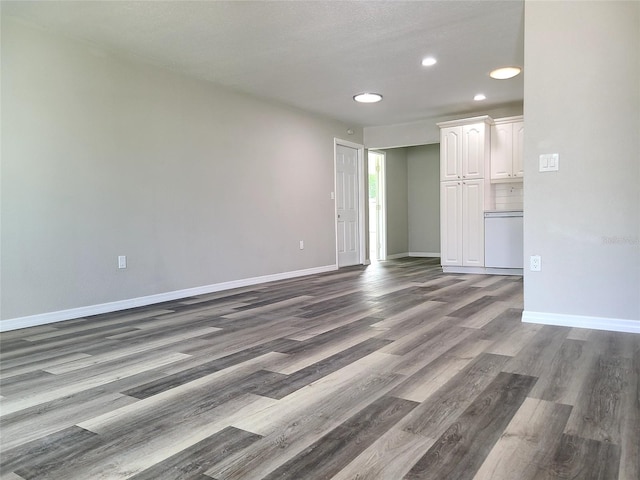 spare room with dark hardwood / wood-style flooring