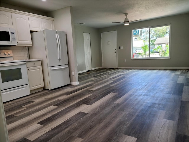 kitchen featuring dark hardwood / wood-style flooring, white cabinetry, white appliances, and ceiling fan