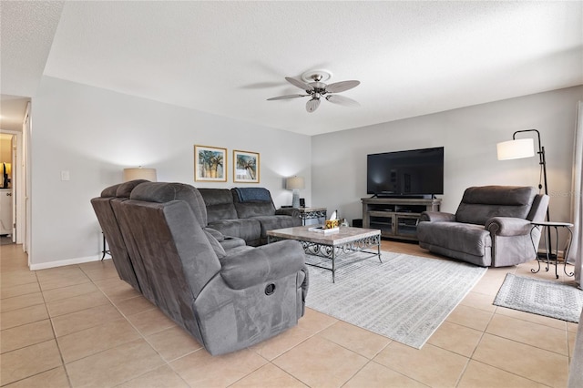 tiled living room featuring a textured ceiling and ceiling fan