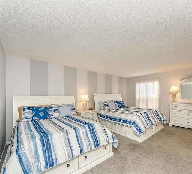 carpeted bedroom with a textured ceiling