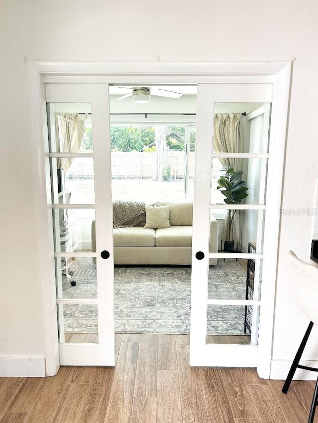 entryway featuring french doors and hardwood / wood-style flooring