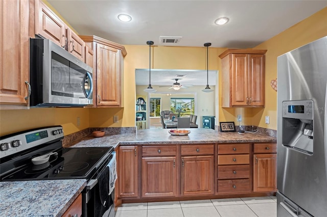 kitchen featuring appliances with stainless steel finishes, ceiling fan, light tile patterned floors, pendant lighting, and stone counters