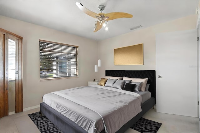 bedroom featuring multiple windows and ceiling fan