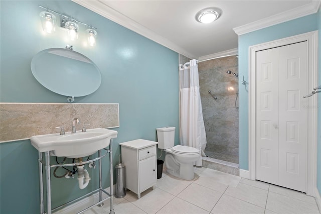 bathroom with tile patterned floors, a shower with curtain, toilet, and ornamental molding