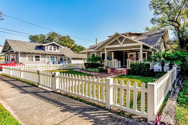 view of front facade with a porch and a garage