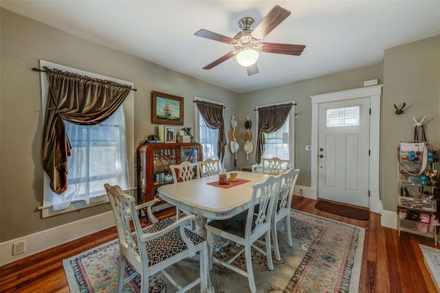 dining room featuring dark hardwood / wood-style floors and ceiling fan