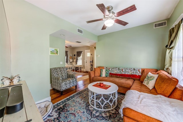 living room with ceiling fan and hardwood / wood-style flooring