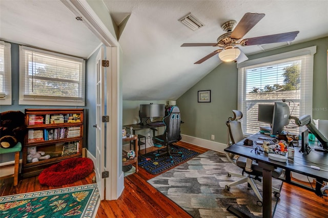 office area featuring lofted ceiling, a textured ceiling, wood-type flooring, and ceiling fan