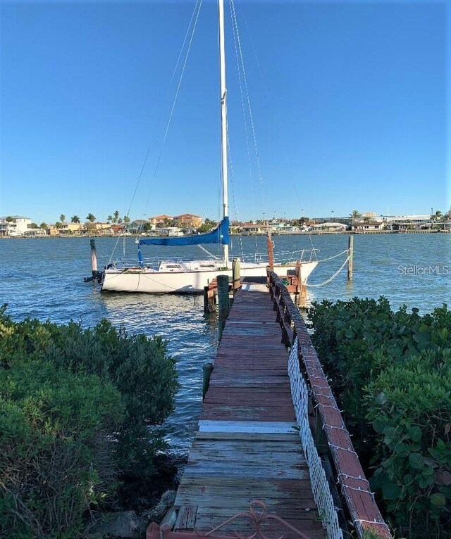 dock area with a water view