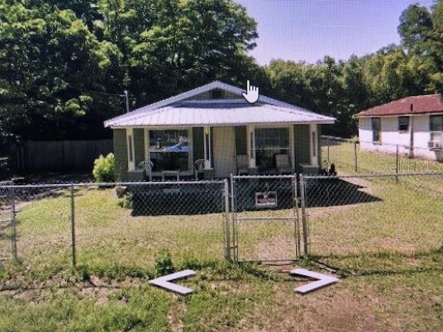 view of front facade with covered porch and a front yard