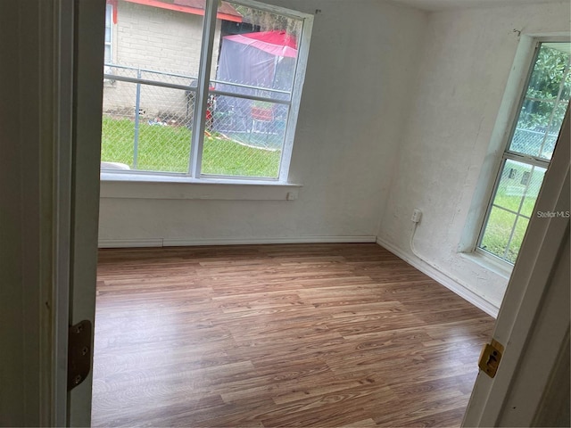 spare room featuring hardwood / wood-style flooring