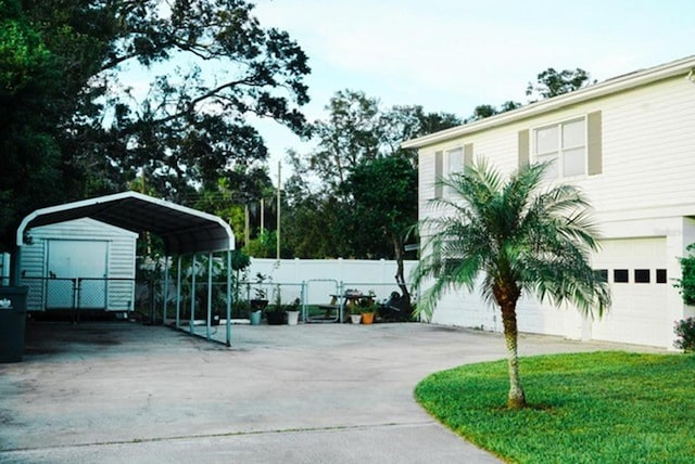 exterior space with a garage and a carport