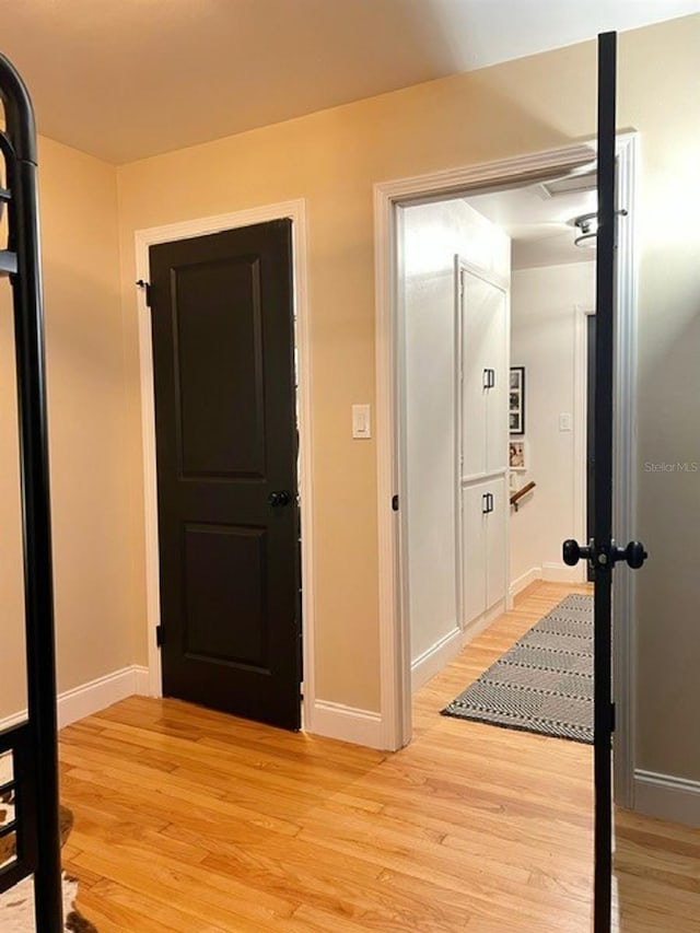 hall with light hardwood / wood-style flooring