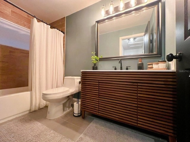 full bathroom featuring vanity, shower / bath combo, toilet, and tile patterned flooring