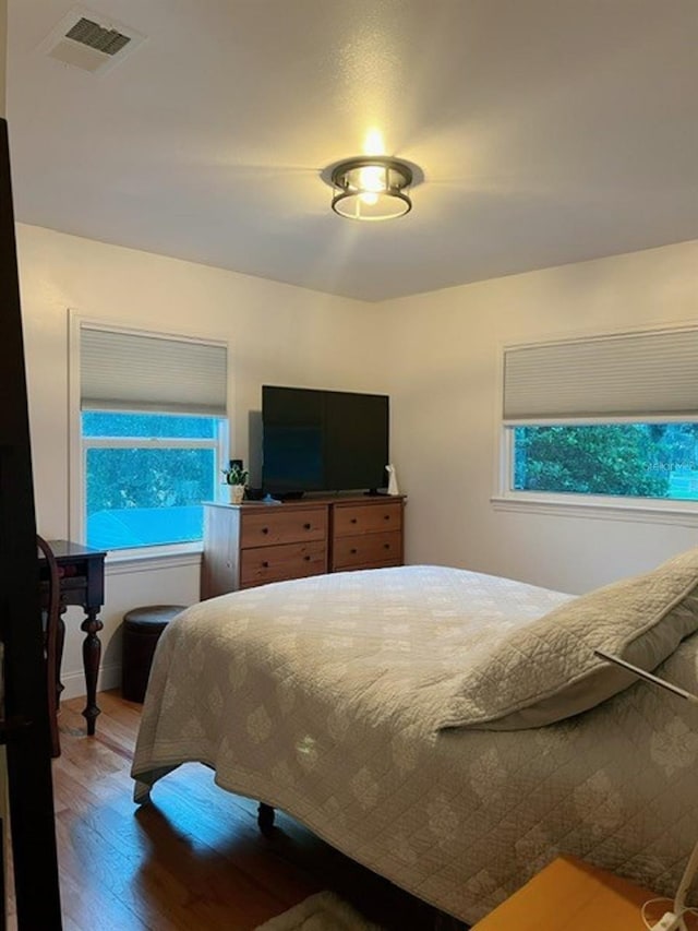 bedroom featuring hardwood / wood-style floors