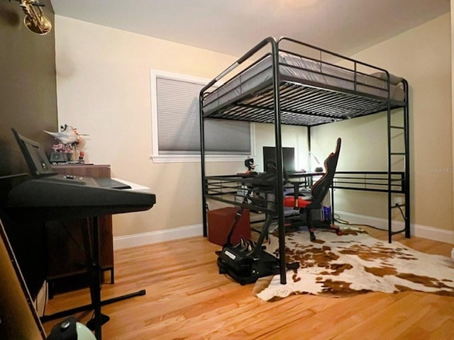 bedroom with hardwood / wood-style floors