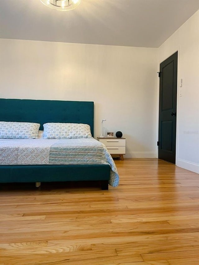 bedroom with light hardwood / wood-style floors