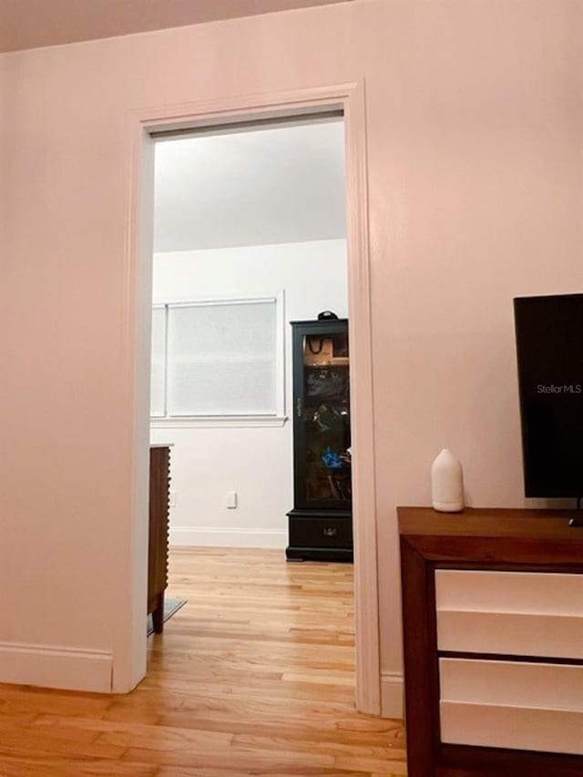 hallway with light wood-type flooring