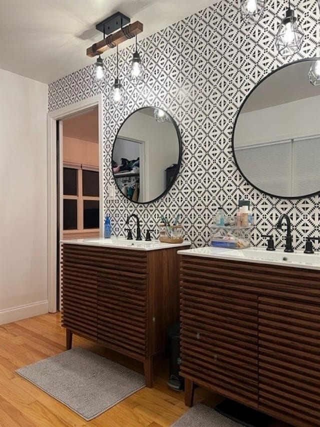 bathroom with vanity and hardwood / wood-style floors