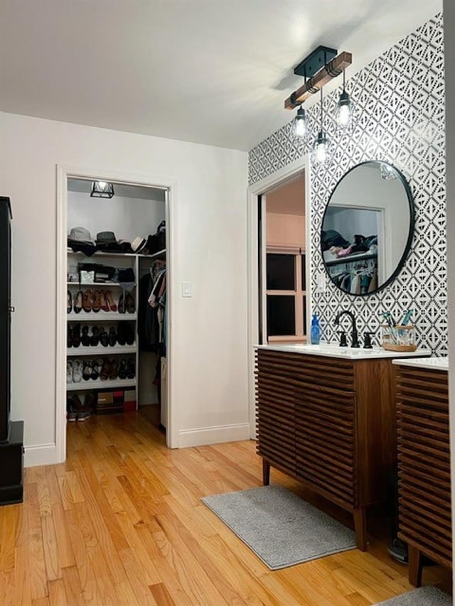 bathroom with vanity and hardwood / wood-style floors