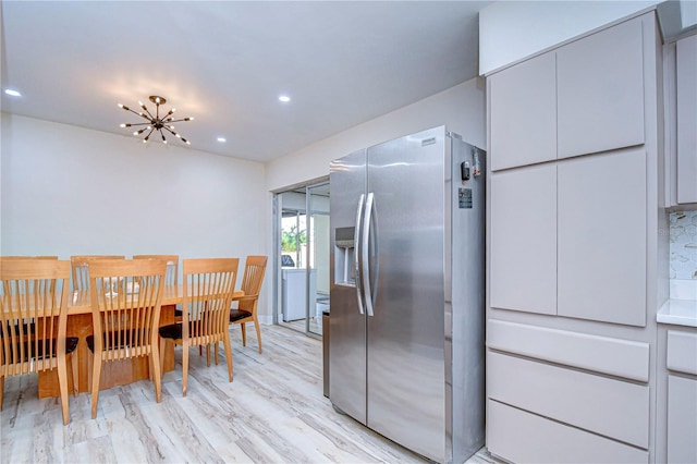 1802 E Hamilton Ave, Tampa, FL 33610 - dining area featuring a chandelier, light wood finished floors, and recessed lighting