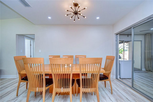 1802 E Hamilton Ave, Tampa, FL 33610 - dining space featuring a chandelier, light wood-style floors, and recessed lighting