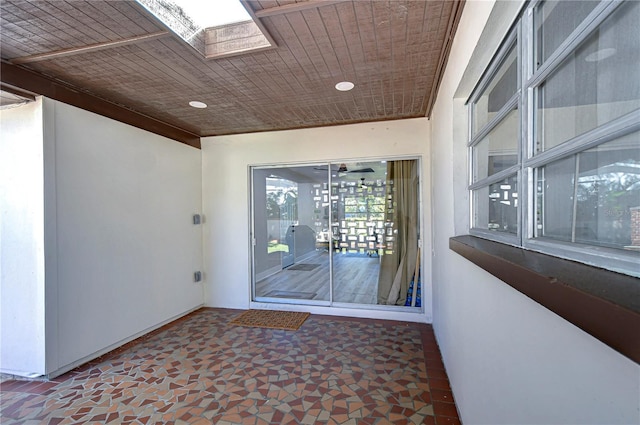 1802 E Hamilton Ave, Tampa, FL 33610 - spare room featuring a skylight and baseboards