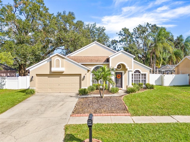 ranch-style home with a front yard and a garage