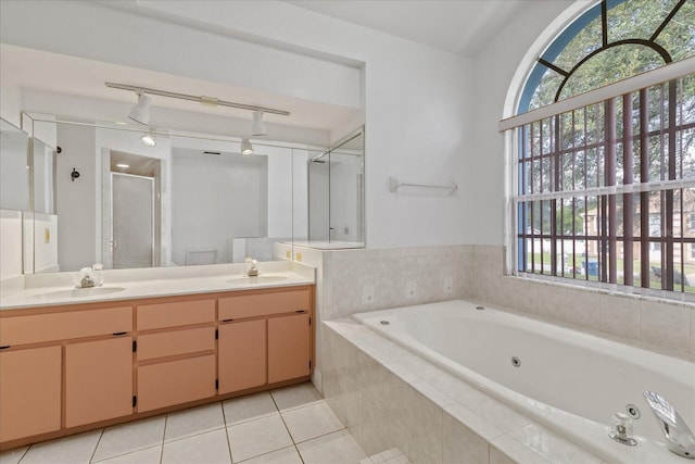 bathroom with vanity, shower with separate bathtub, and tile patterned floors