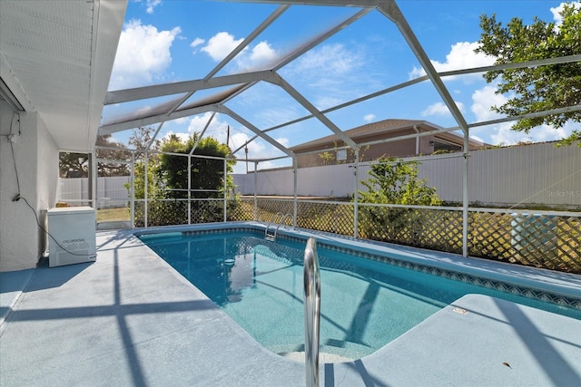 view of pool with a patio, a lanai, and ac unit