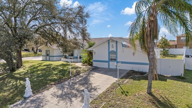 ranch-style home with a front lawn