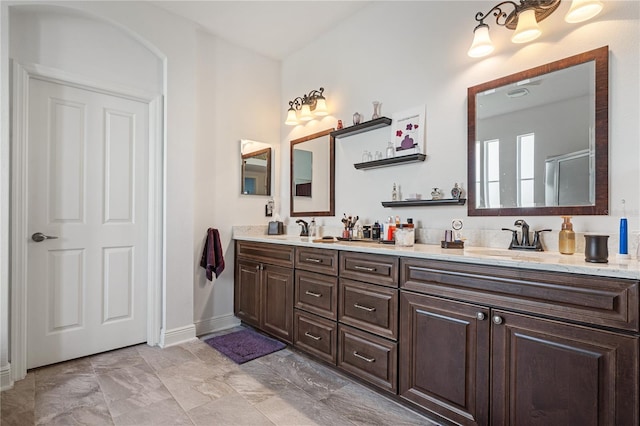 bathroom with vanity and walk in shower