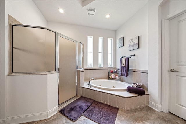 bathroom featuring shower with separate bathtub and tile patterned flooring