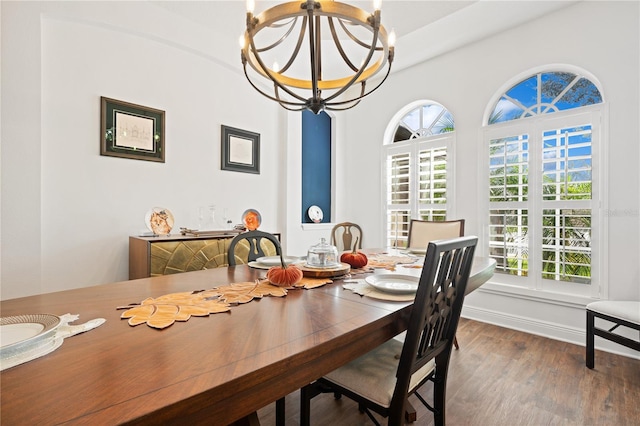 dining space featuring an inviting chandelier, hardwood / wood-style flooring, and plenty of natural light