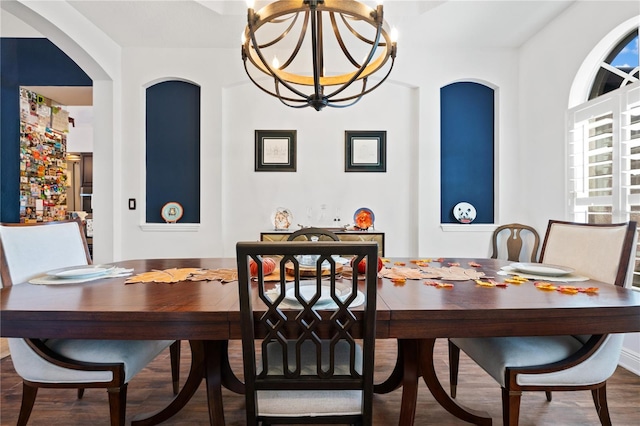 dining area with a chandelier and hardwood / wood-style flooring