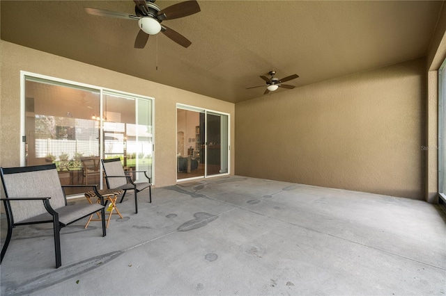 view of patio featuring ceiling fan