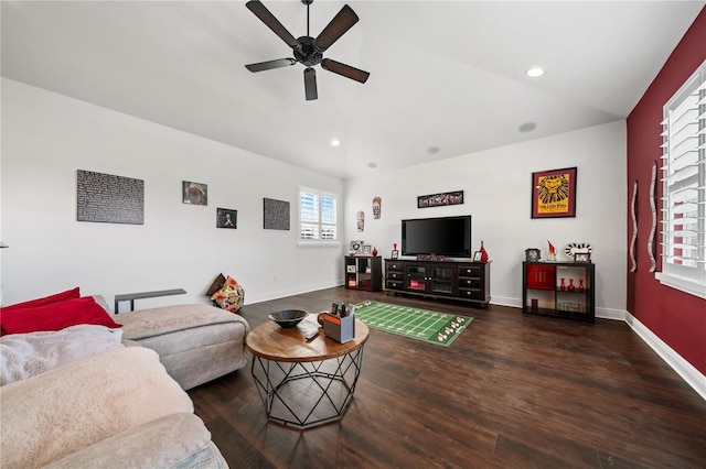 living room featuring ceiling fan, vaulted ceiling, and dark hardwood / wood-style flooring